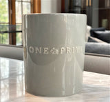 Discover the Moroccan Amber Perfumed Estate Candle from One Preevay. Handcrafted with essential oils and soy wax, this 21.2 oz candle features a triple wick and pale gray porcelain vessel. Enjoy the blend of sweet patchouli, heliotrope with Canaan Tray