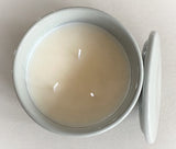 Indulge in the French Black Orchid Perfumed Estate Candle from One Preevay. Handcrafted with premium essential oils and organic soy wax, it features a pale gray ceramic vessel. With a triple wick and 21.2 oz size, enjoy the aromatic blend of blackberry, patchouli, and spices. Elevate your ambiance today with three wicks
