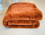 Experience luxury redefined with ONE Preevay's Faux Rabbit Fur Throw in Coco Brown. Inspired by Fernando Botero and crafted from Ultra Premium Faux Rabbit Fur. Hypoallergenic, cruelty-free, and lined with elegant velvet for refined warmth and sophistication. 800gsm 50x60 inches