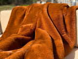 Experience luxury redefined with ONE Preevay's Faux Rabbit Fur Throw in Coco Brown. Inspired by Fernando Botero and crafted from Ultra Premium Faux Rabbit Fur. Hypoallergenic, cruelty-free, and lined with elegant velvet for refined warmth and sophistication. 800gsm, 50x60 inches. Coco Brown 
