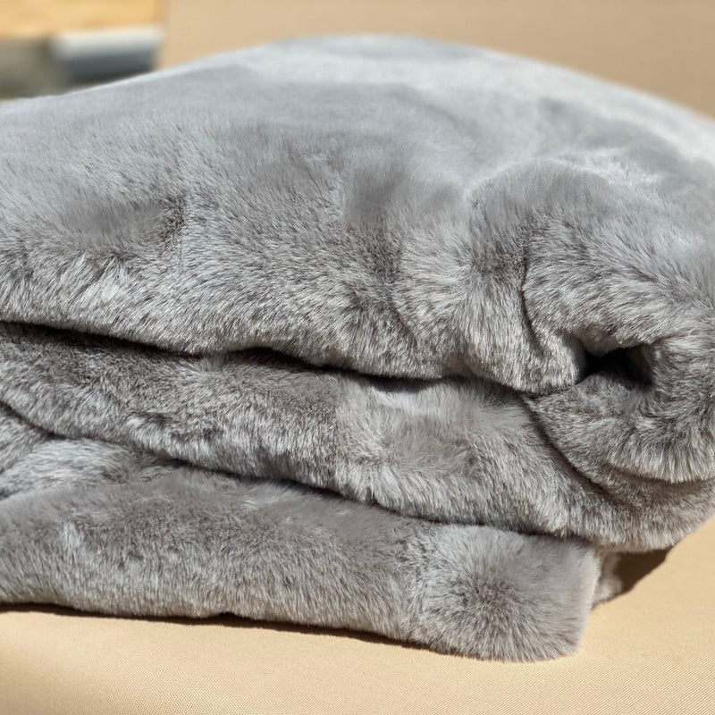 Experience luxury redefined with ONE Preevay's Faux Rabbit Fur Throw in Dramatic Gray. Inspired by Fernando Botero, crafted from Ultra Premium Faux Rabbit Fur. Hypoallergenic, cruelty-free, and lined with elegant velvet for refined warmth