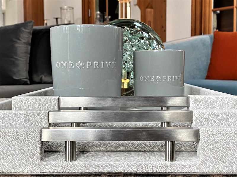 Luxury shagreen serving tray with inlaid nickel handles and ivory velvet underside"
2. "Thursby Shagreen Hotel Tray - exotic embossed leather and nickel accents"
3. "High-end serving tray with shagreen leather, inlaid nickel handles, and velvet underside" "Luxury entertaining tray - Thursby Shagreen, embossed leather, nickel handles"
5. "Shagreen leather serving tray with inlaid nickel handles and elegant design"
Luxury serving trays
Shagreen leather trays