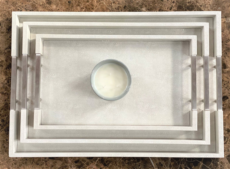 Discover the Thursby Shagreen Hotel Tray from One Preevay—a luxurious serving tray crafted with exotic embossed leather and nickel hardware. Available in three sizes: 17"x10", 20"x13", and 23"x15". Elevate your entertaining experience with sophistication