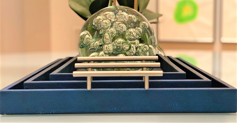 Discover the Canaan Shagreen Serving Tray from One Preevay—a luxurious tray crafted with sea blue exotic embossed leather and nickel hardware. Available in three sizes: 17"x10", 20"x13", and 23"x15". Elevate your entertaining experience with sophistication and style. Order now soon
