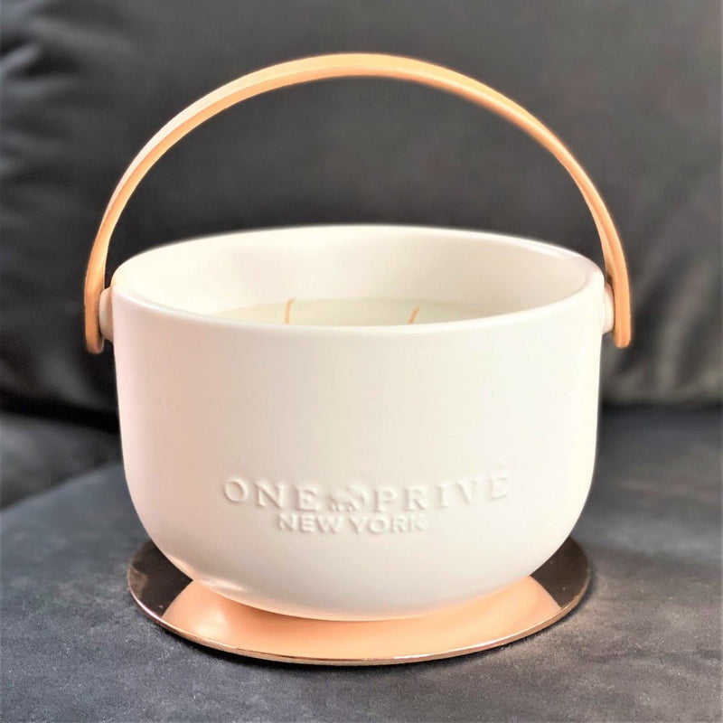 Discover the Grapefruit Neroli Perfumed Estate Candle from One Preevay. Handcrafted with premium essential oils and soy wax, it features a porcelain bowl with a silver-plated lid and leather strap. Enjoy the aromatic fusion of grapefruit and neroli. Order now to elevate your ambiance always 
