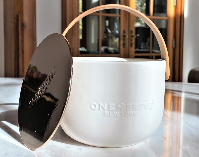 Discover the Grapefruit Neroli Perfumed Estate Candle from One Preevay. Handcrafted with premium essential oils and soy wax, it features a porcelain bowl with a silver-plated lid and leather strap. Enjoy the aromatic fusion of grapefruit and neroli. Order now to elevate your ambiance to love and enjoy
