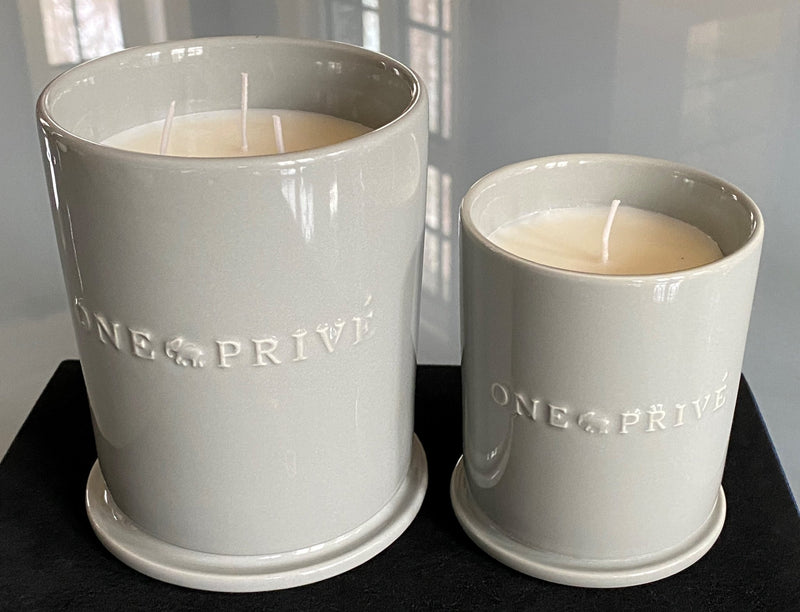 Discover the Moroccan Amber Perfumed Estate Candle from One Preevay. Handcrafted with essential oils and soy wax, this 21.2 oz candle features a triple wick and pale gray porcelain vessel with Two