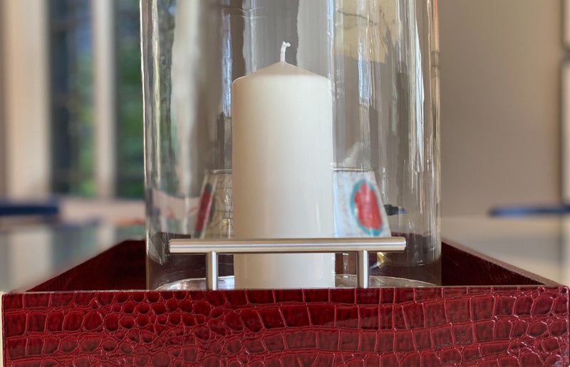 Discover the Pemberley Butler Red Leather Tray from One Preevay Luxury Home Furnishings—a masterpiece of sophistication and style. Handcrafted with embossed red crocodile leather, elegant nickel handles, and a luxurious black velvet underside, this tray is perfect for elevating your entertaining experience. Available in two spacious sizes, 15.8x15.8 inches and 19x14 inches, it combines exquisite craftsmanship with versatile functionality. Order now to indulge in the art of luxury entertaining.
