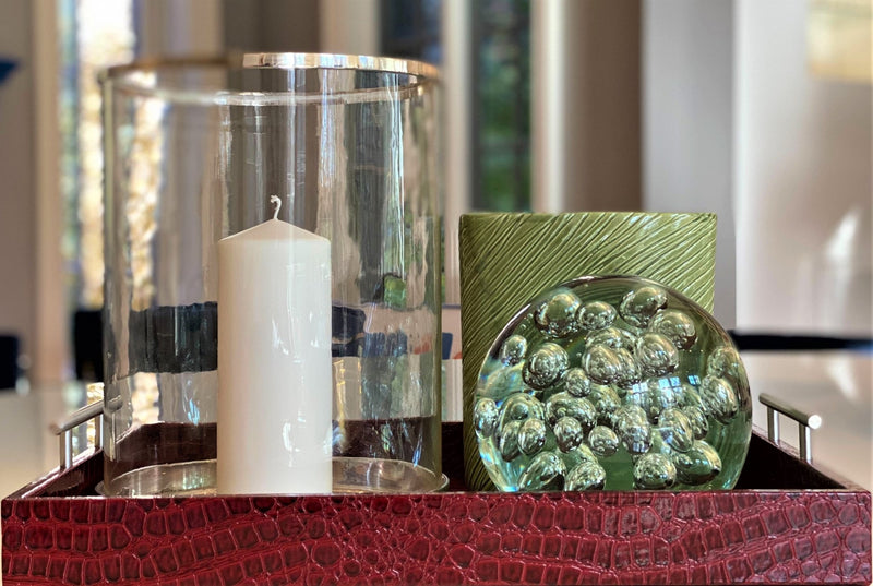 Discover the Pemberley Butler Red Leather Tray from One Preevay Luxury Home Furnishings—a masterpiece of sophistication and style. Handcrafted with embossed red crocodile leather, elegant nickel handles, and a luxurious black velvet underside, this tray is perfect for elevating your entertaining experience. Available in two spacious sizes, 15.8x15.8 inches and 19x14 inches, it combines exquisite craftsmanship with versatile functionality. Order now to indulge in the art of luxury lifestyle 
