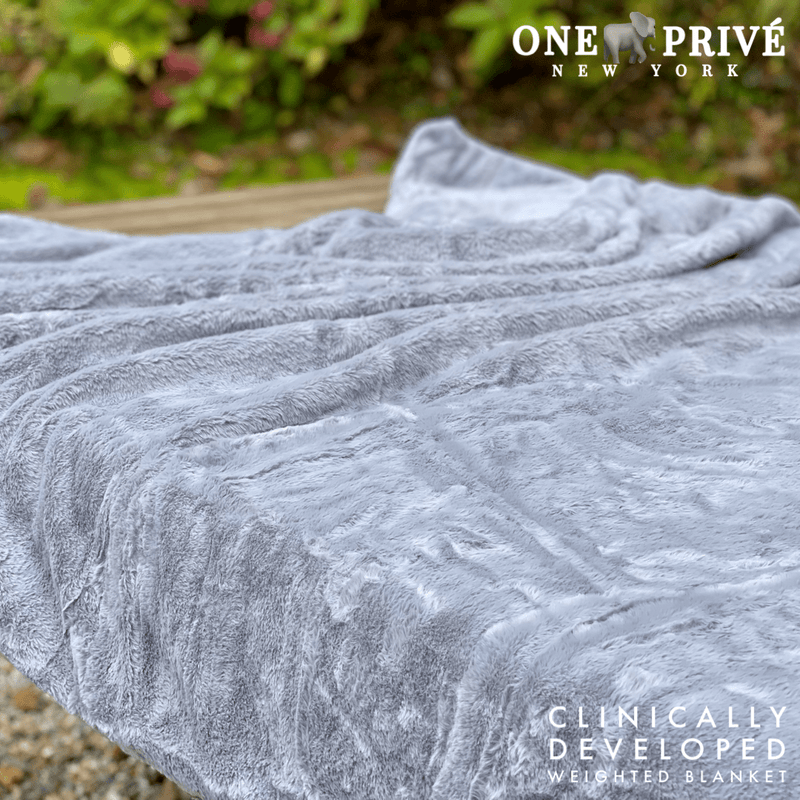 Experience luxurious relaxation with One Preevay's world's first weighted faux rabbit fur blanket, inspired by Fernando Botero. Clinically developed, 20lbs, hypoallergenic, and luxurious for 