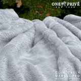 Experience luxurious relaxation with One Preevay's world's first weighted faux rabbit fur blanket, inspired by Fernando Botero. Clinically developed, 20lbs, hypoallergenic, and luxurious for serene sleep & relaxation always 