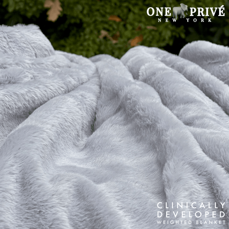 Experience luxurious relaxation with One Preevay's world's first weighted faux rabbit fur blanket, inspired by Fernando Botero. Clinically developed, 20lbs, hypoallergenic, and luxurious for serene sleep & relaxation always 