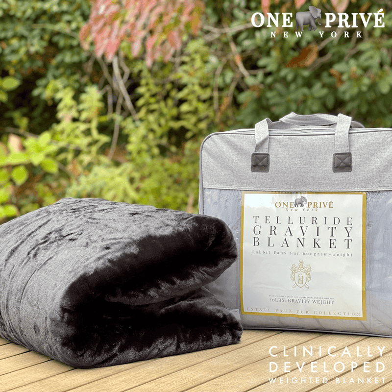Experience luxurious relaxation with the One Preevay Luxury Home Furnishings, world's first weighted faux rabbit fur blanket, inspired by Fernando Botero. Clinically developed, 20lbs, queen size, and hypoallergenic. Perfect for a serene sleep and in black