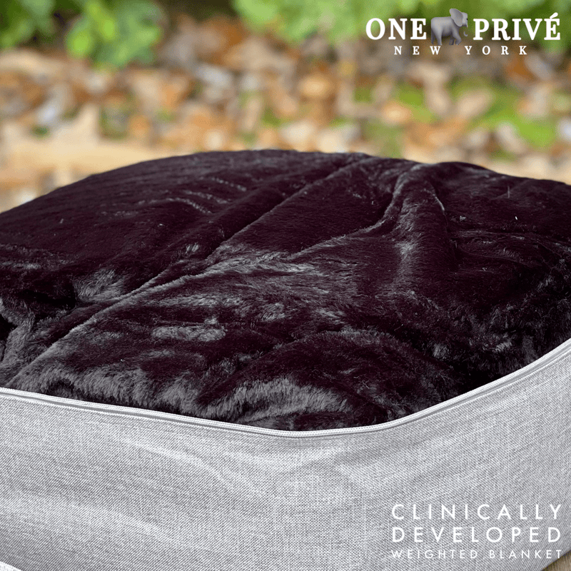 Experience luxurious relaxation with the One Preevay Luxury Home Furnishings, world's first weighted faux rabbit fur blanket, inspired by Fernando Botero. Clinically developed, 20lbs, queen size, and hypoallergenic. Perfect for a serene sleep black color 