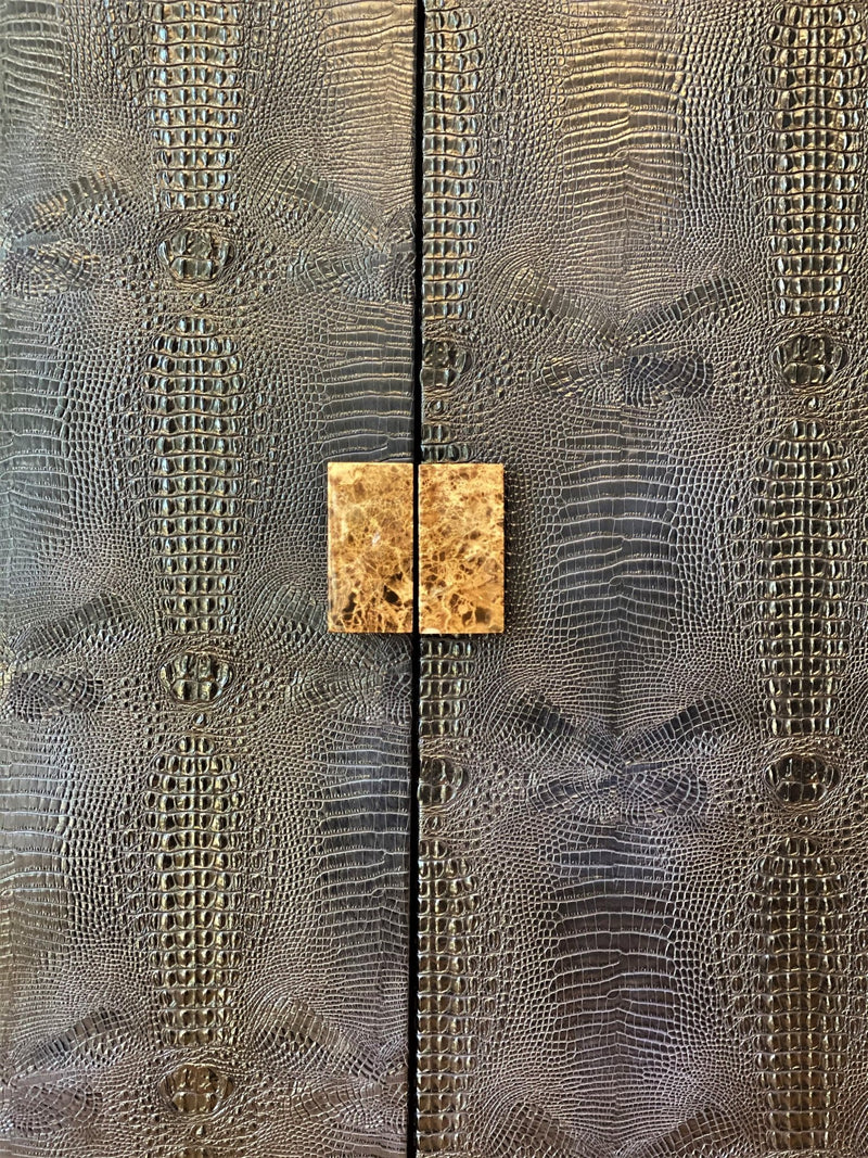 Experience ultra-luxury with One Preevay's bespoke Crocodile Armoire. Inspired by Louis XIV, this customizable piece combines elegance & functionality. Handcrafted with faux crocodile leather, ebony wood & marble handles. Starting at $7,500.