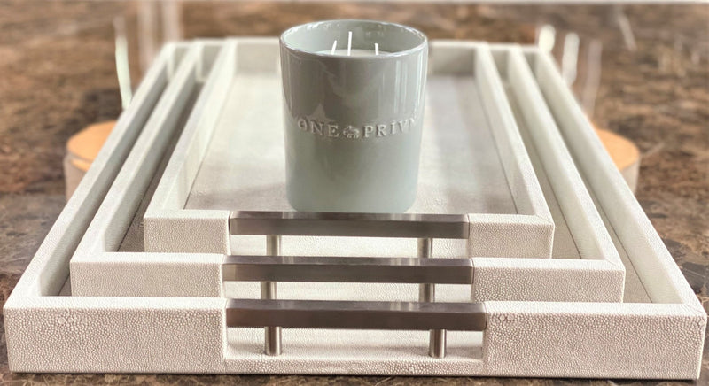 Indulge in the French Black Orchid Perfumed Estate Candle from One Preevay. Handcrafted with premium essential oils and organic soy wax, it features a pale gray ceramic vessel. With a triple wick and 21.2 oz size, enjoy the aromatic blend of blackberry, patchouli, and spices. Elevate your ambiance today with a tray 
