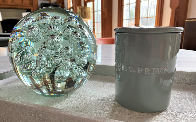 Discover the Moroccan Amber Perfumed Estate Candle from One Preevay. Handcrafted with essential oils and soy wax, this 21.2 oz candle features a triple wick and pale gray porcelain vessel with Two Thursby....